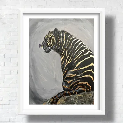 коричневый и черный тигр, лежащий на коричневой скале - онлайн-пазл
