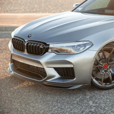 New BMW M5 F90 LCI Competition in a red color on the forest road. Kyiv,  Ukraine - June 2021. Stock Photo | Adobe Stock