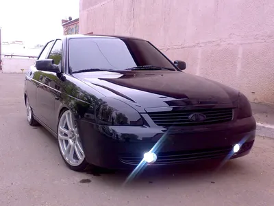 Night shot of a lada priora with cat eye headlights on Craiyon