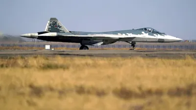 There was a photo of the Su-57 with an unknown hanging container